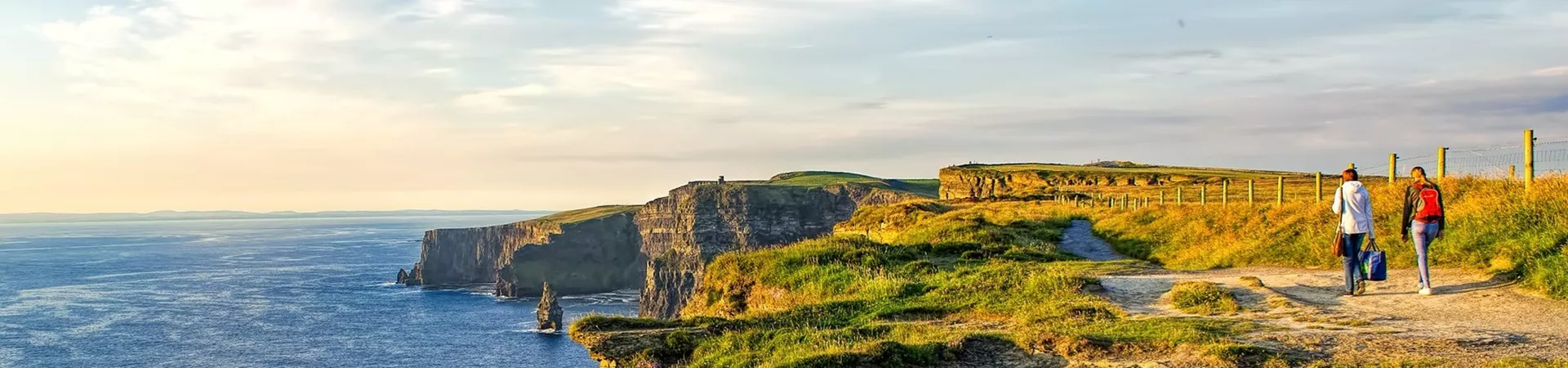 Travellers On Cliffs of Moher in Ireland