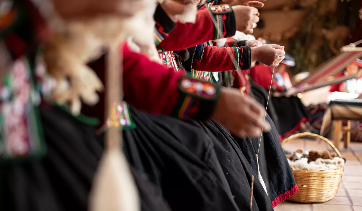 Women In Traditional Outfits Sewing