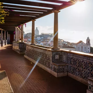 Miradouro De Santa Luzia viewpoint over Lisbon, Portugal at dusk