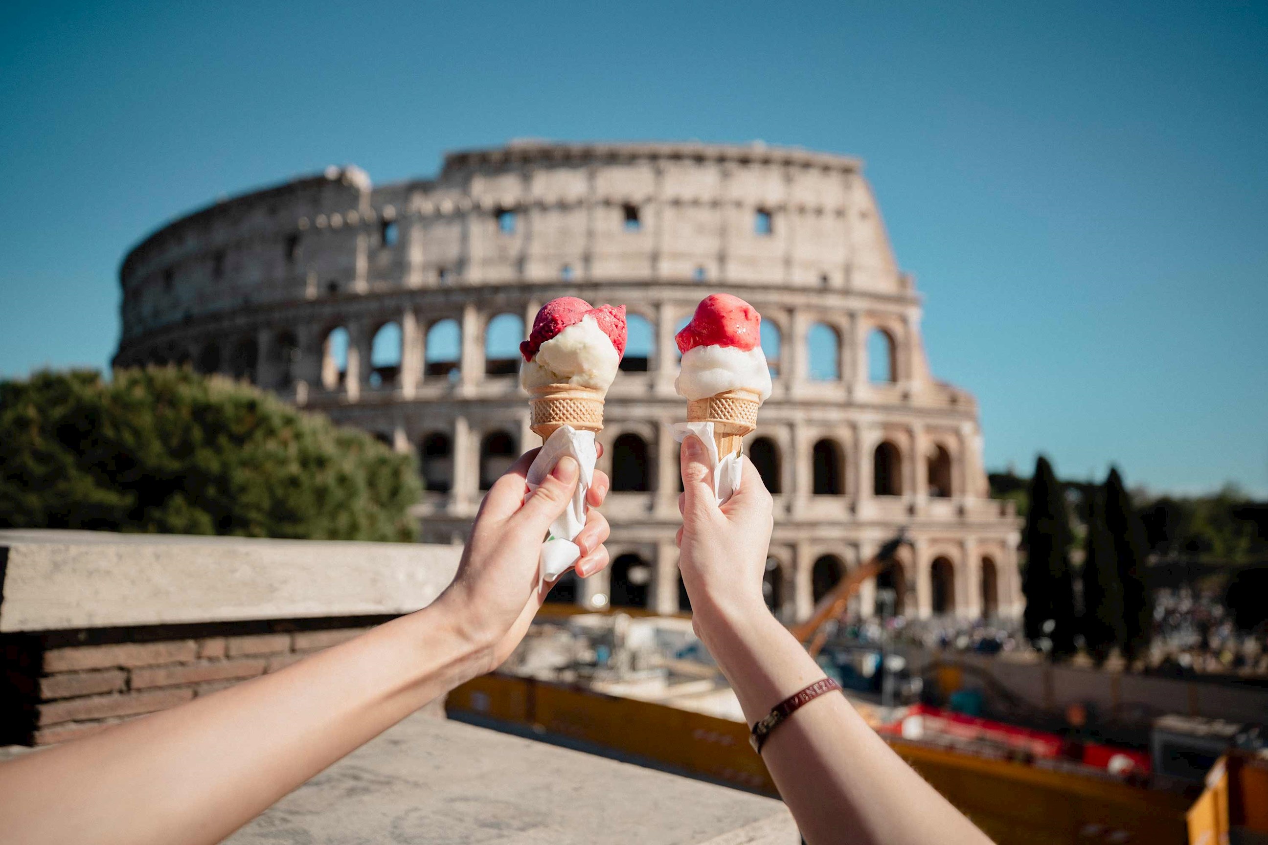Two ice cream cones in front of the Colosseum in Rome 