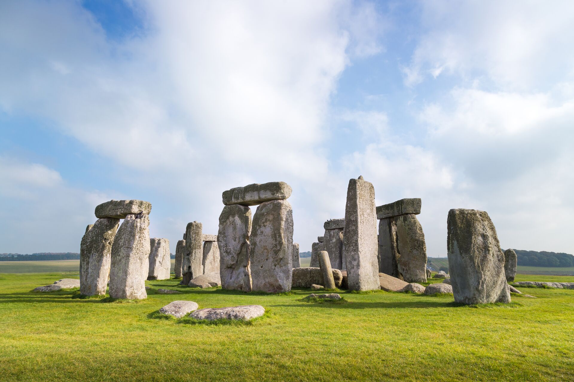 Ruins of Stonehenge on green meadow in UK