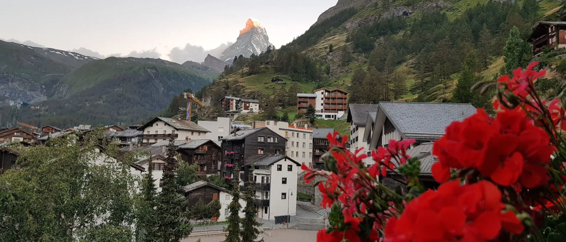 A view of a town in Austria with mountains in the background