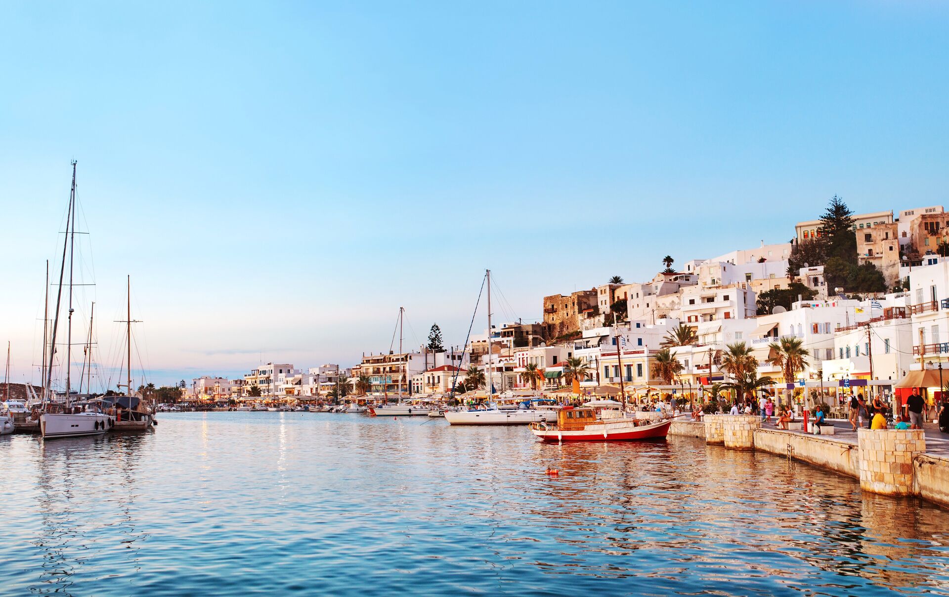 Sun setting over seaside old town in Greece