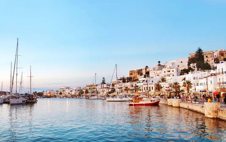 Sun setting over seaside old town in Greece
