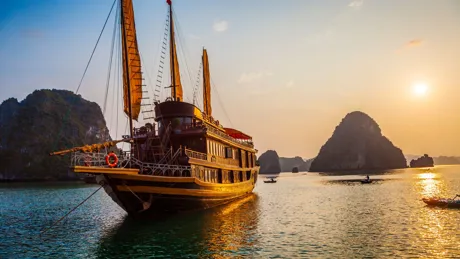 Chinese Boat In Halong Bay at sunset