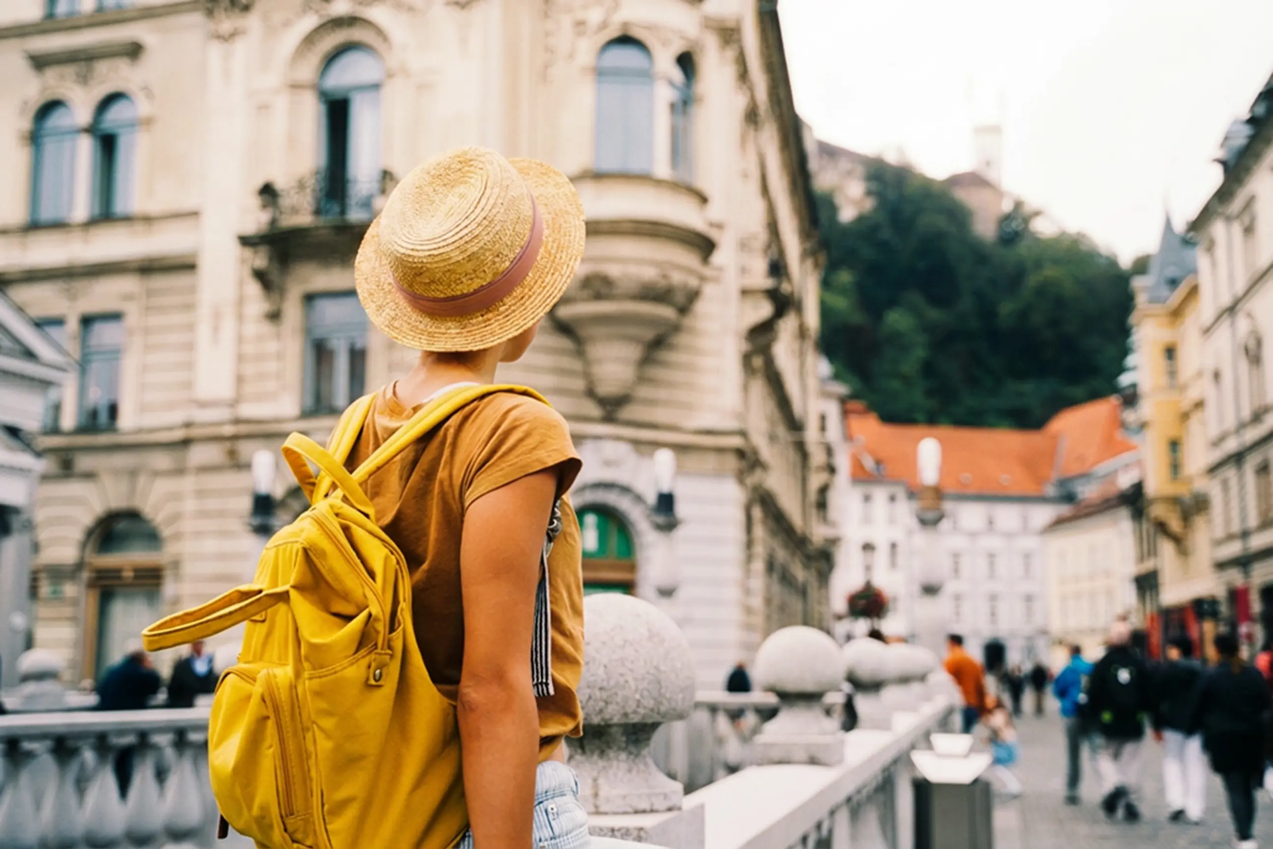 day-hero-youg-woman-triple-bridge-ljubljana-slovenia-1180827524.webp
