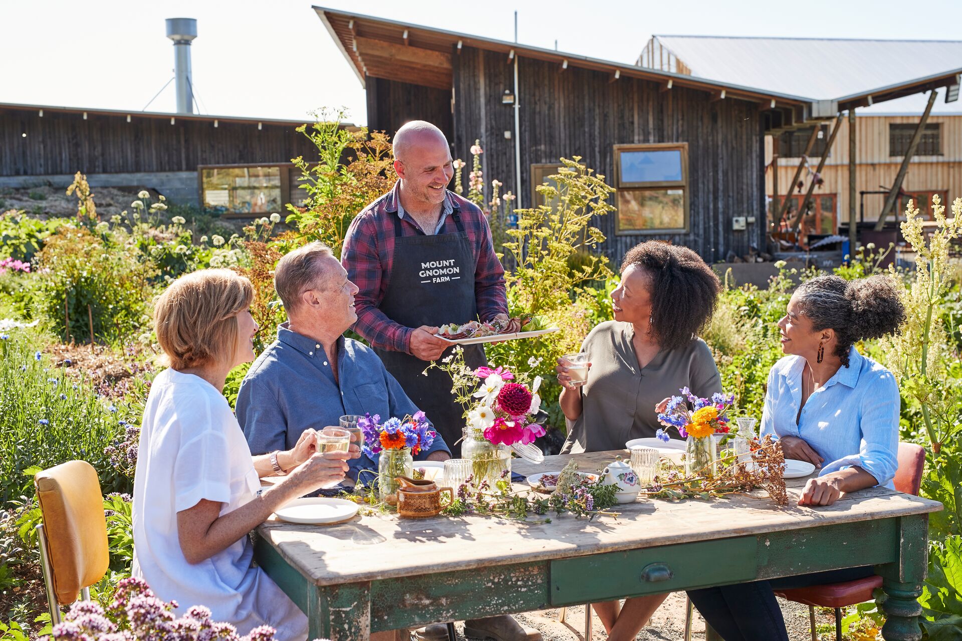 People Eating Lunch At Mount Gnomon Farm With Guy Robertson in Australia Tasmania