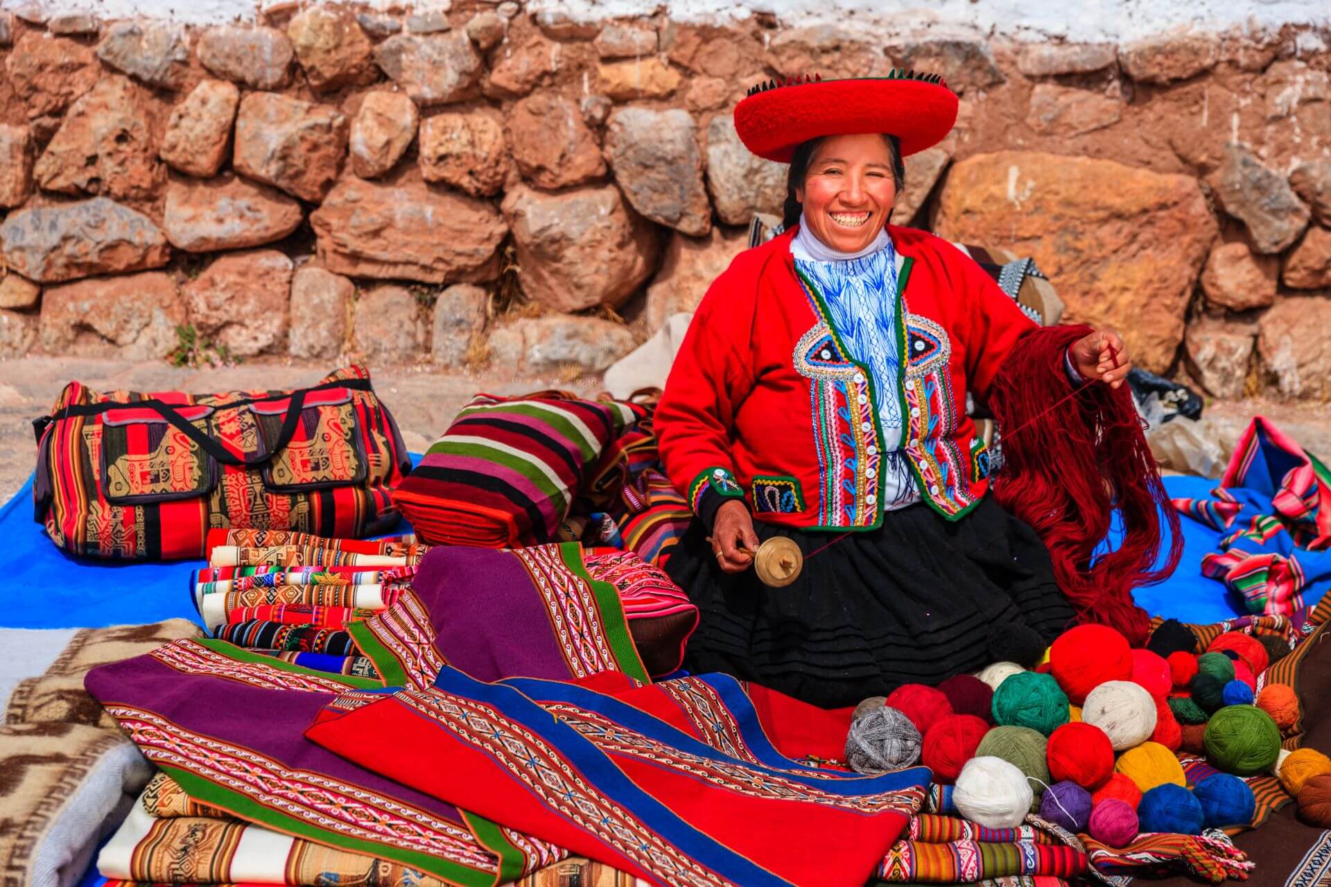 Peruvian woman spinning wool by hand