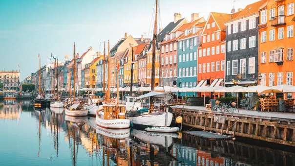 Colourful Townhouses Facades And Old Ships Along The Nyhavn Canal, Copenhagen