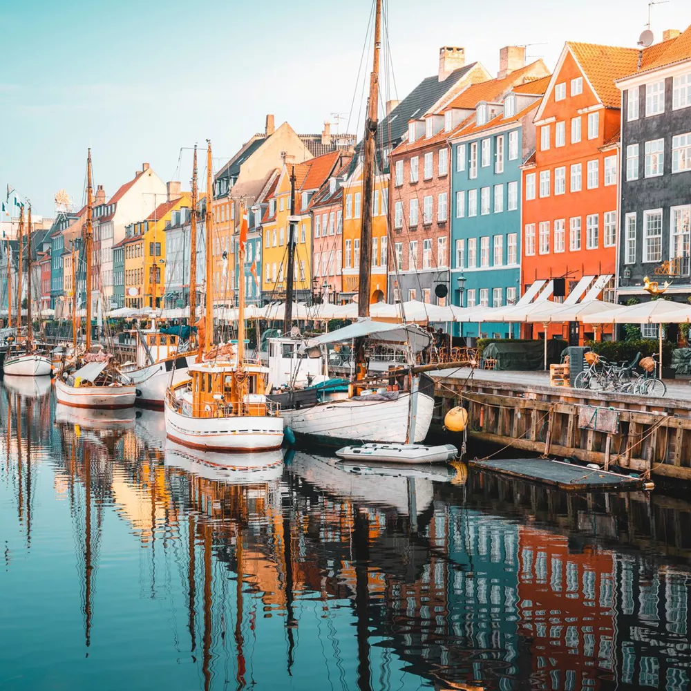 Colourful Townhouses Facades And Old Ships Along The Nyhavn Canal, Copenhagen