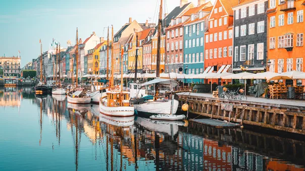 Colourful Townhouses Facades And Old Ships Along The Nyhavn Canal, Copenhagen