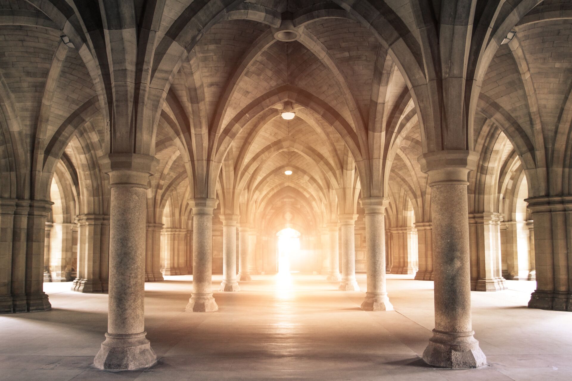 Light shining through the pillars of Glasgow University in Glasgow, Scotland