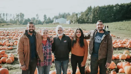 Kris And His Family on pumpkin field at Maan Farms in Fraser Valley, Canada