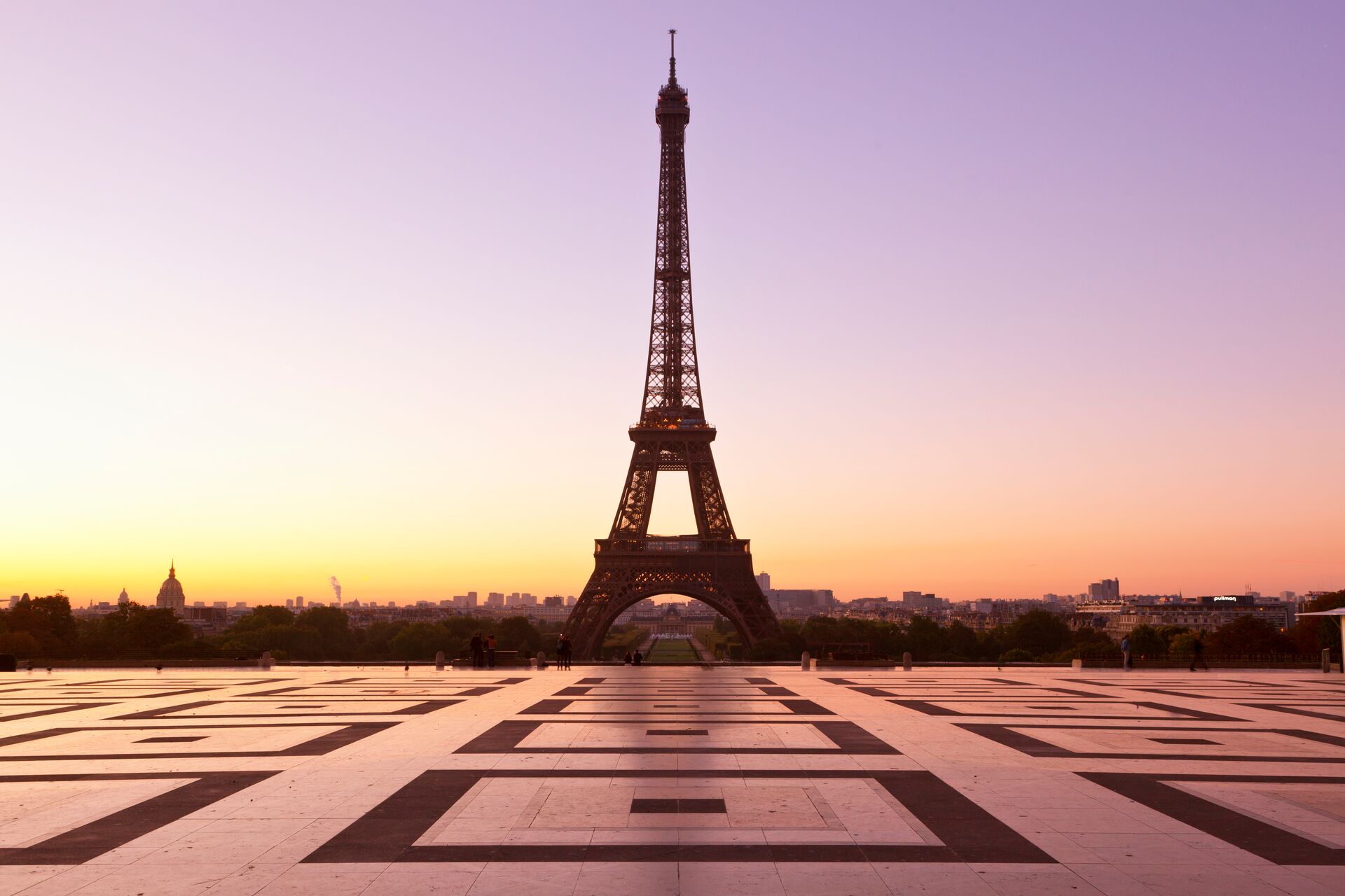 Eiffel Tower silhouetted against the evening sky