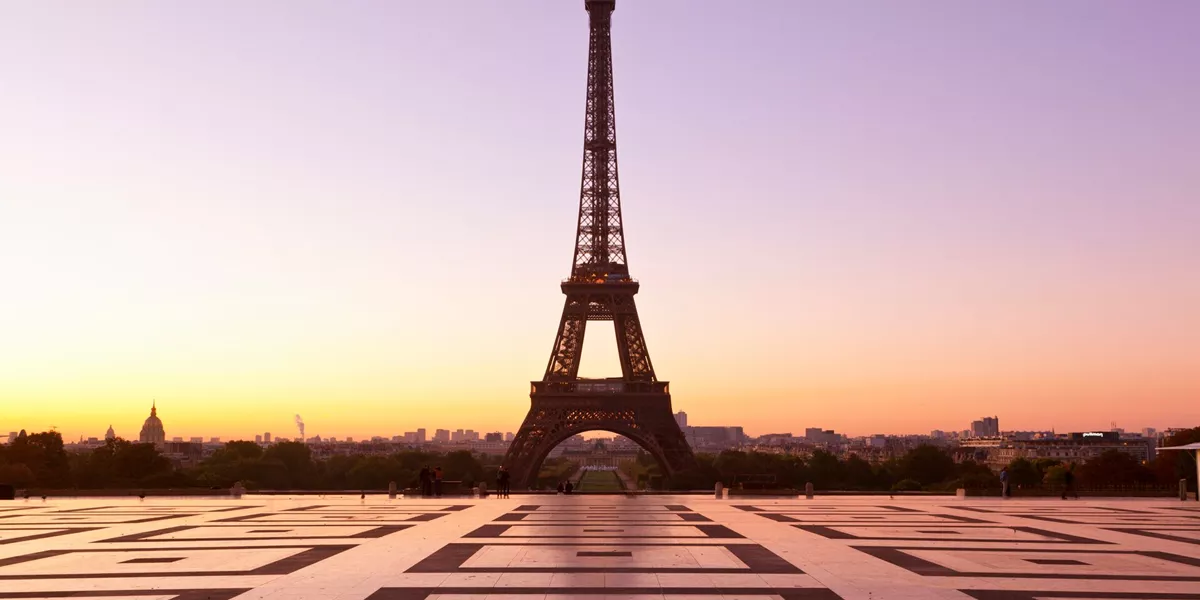 Eiffel Tower silhouetted against the evening sky