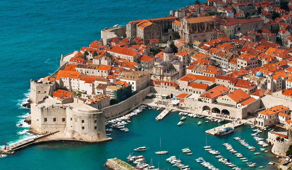 An aerial view of Dubrovnik with boats in the water