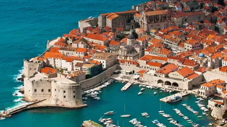 An aerial view of Dubrovnik with boats in the water