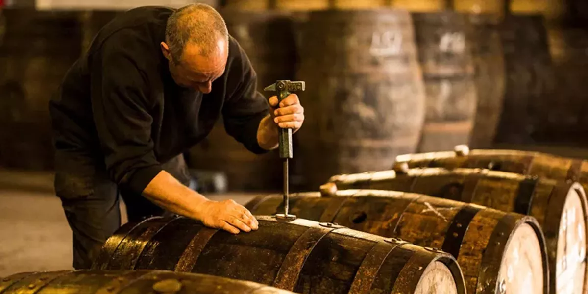 Man Opening Whisky Cask, Glasgow, Scotland