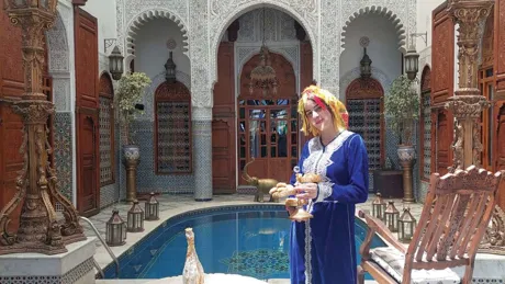 Amina Standing On Piazza Of Riad Arabesque House in Morocco