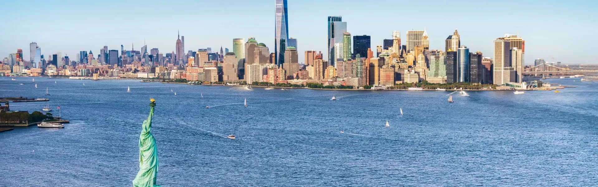 Aerial View Of The Statue Of Liberty In Front Of Manhattan Skyline New York Usa