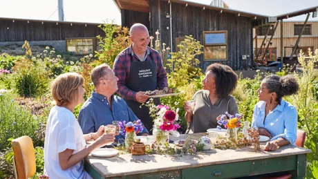 Guests having lunch at Mount Gnomon Farm With Guy Robertson in Tasmania, Australia