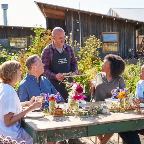 Guests having lunch at Mount Gnomon Farm With Guy Robertson in Tasmania, Australia