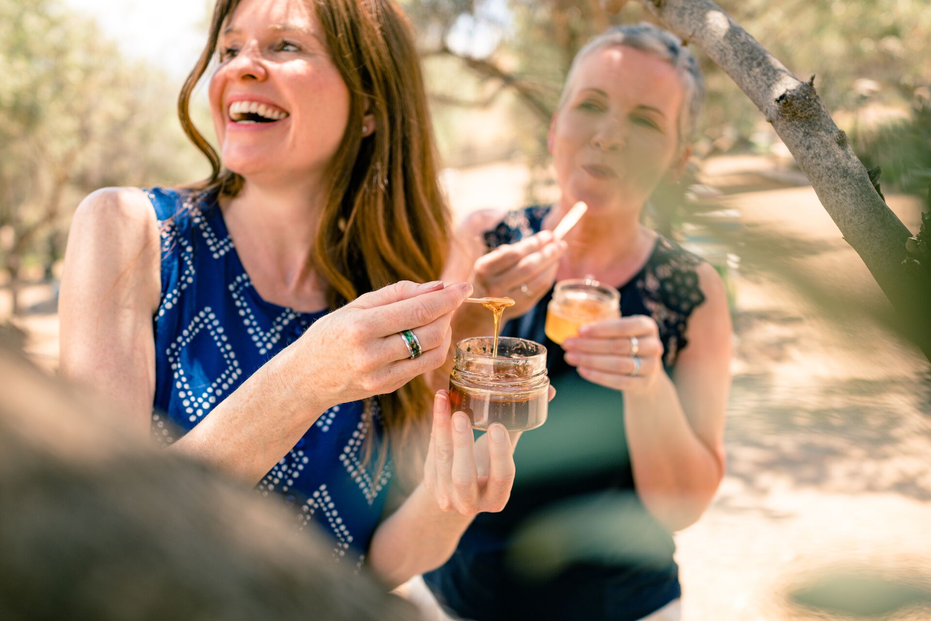 Guests tasting honey at Make Travel Matter Experience at Moka Honey in Delphi, Greece