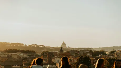 Abstract shot of people in the foreground with beautiful skyline in the background