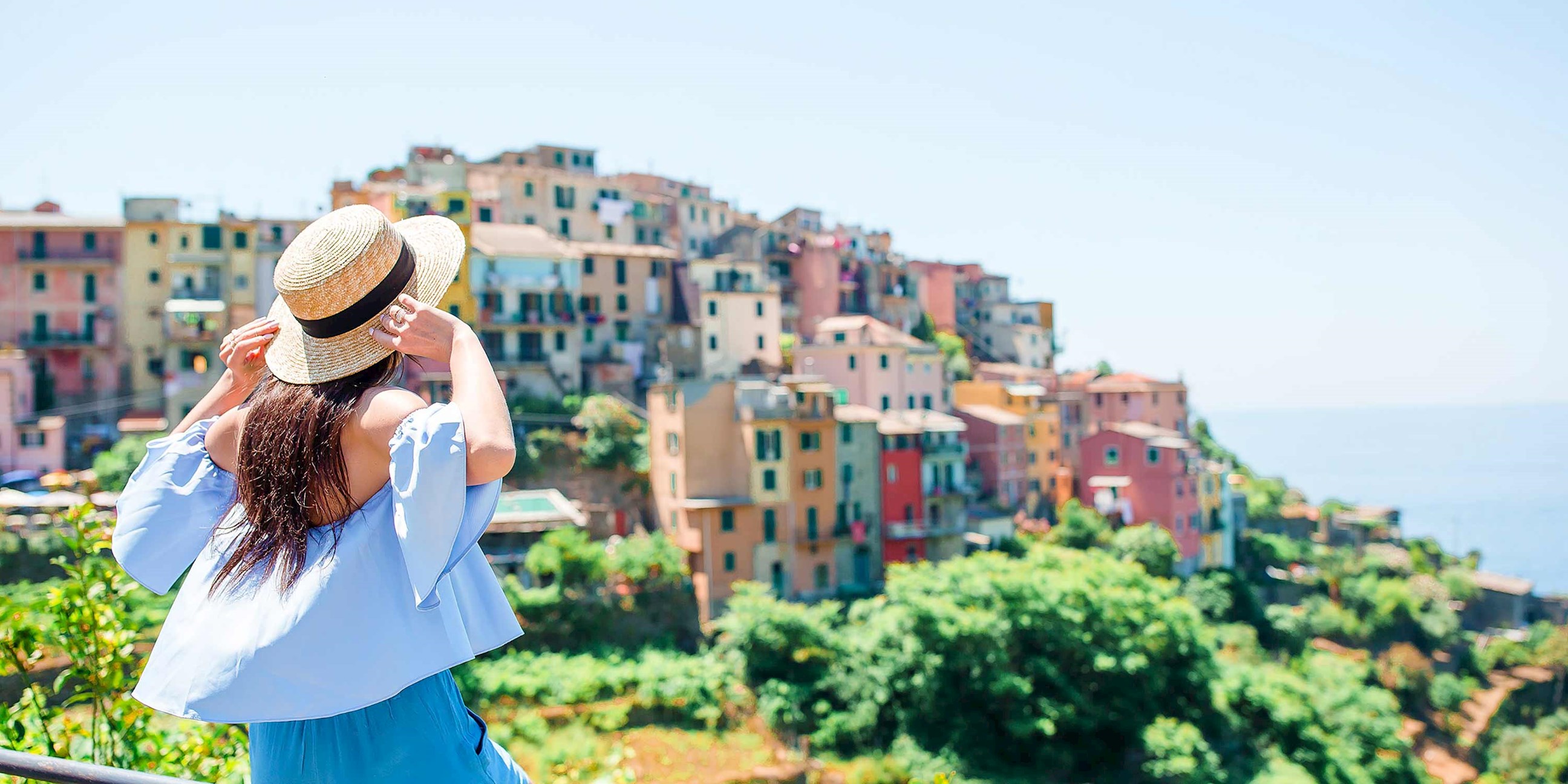 A person looking at the city of Manarola, Italy