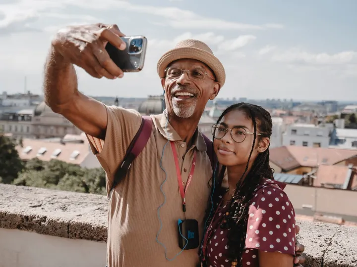 Man And Woman Taking Selfie With View On Old City