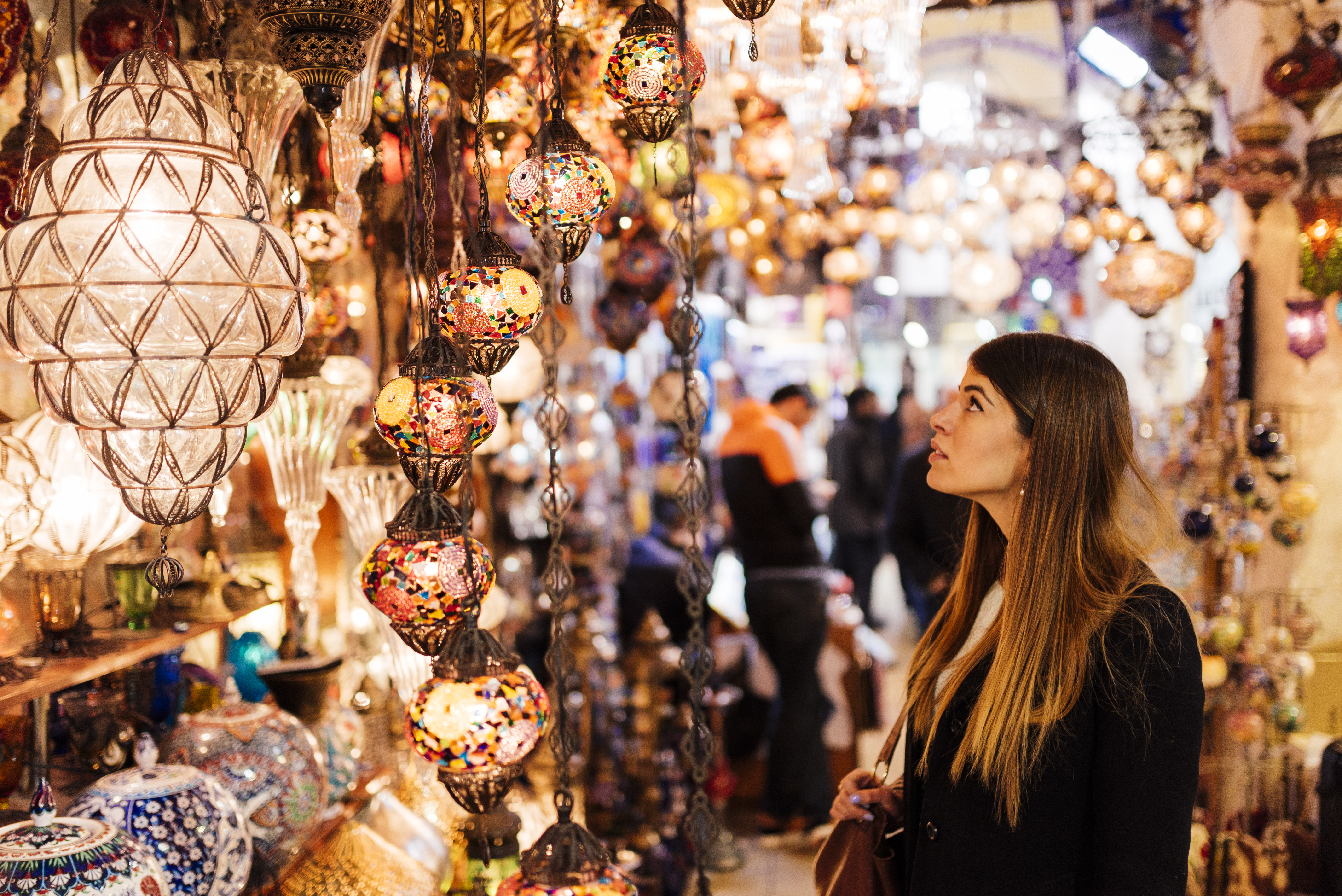 Young Woman Looking At Lights On Market Stall, Istanbul, Turkey 561094161