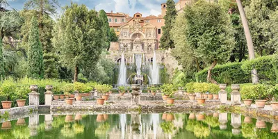 Villa d’Este in Tivoli with fountains, terraced gardens and reflective pool surrounded by greenery