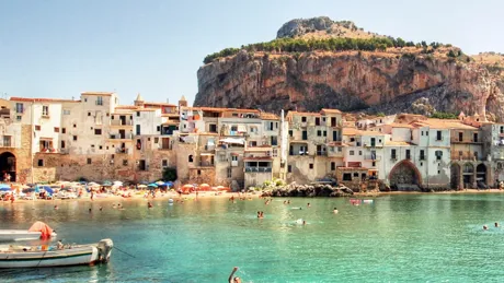 Beachside and houses in Cefalu, Italy