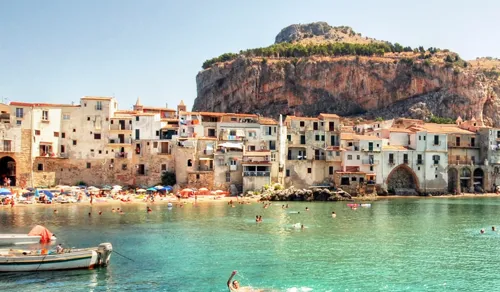 Beachside and houses in Cefalu, Italy