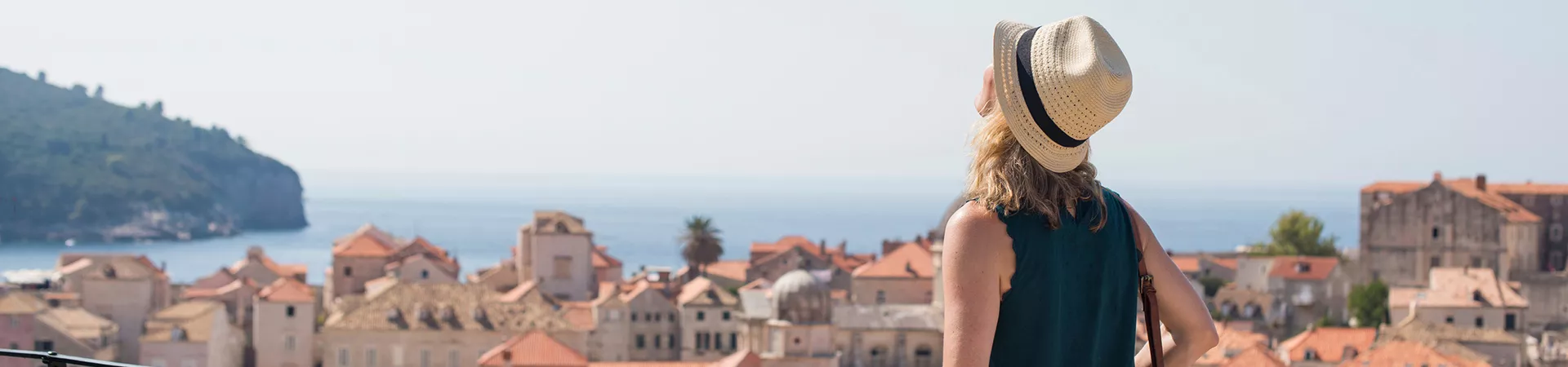 A woman admiring seaview in Dubrovnik, Croatia