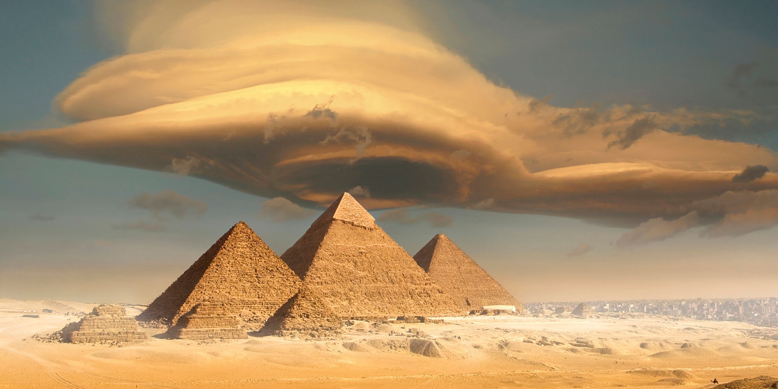 Dramatic storm cloud above pyramids in Giza, Egypt
