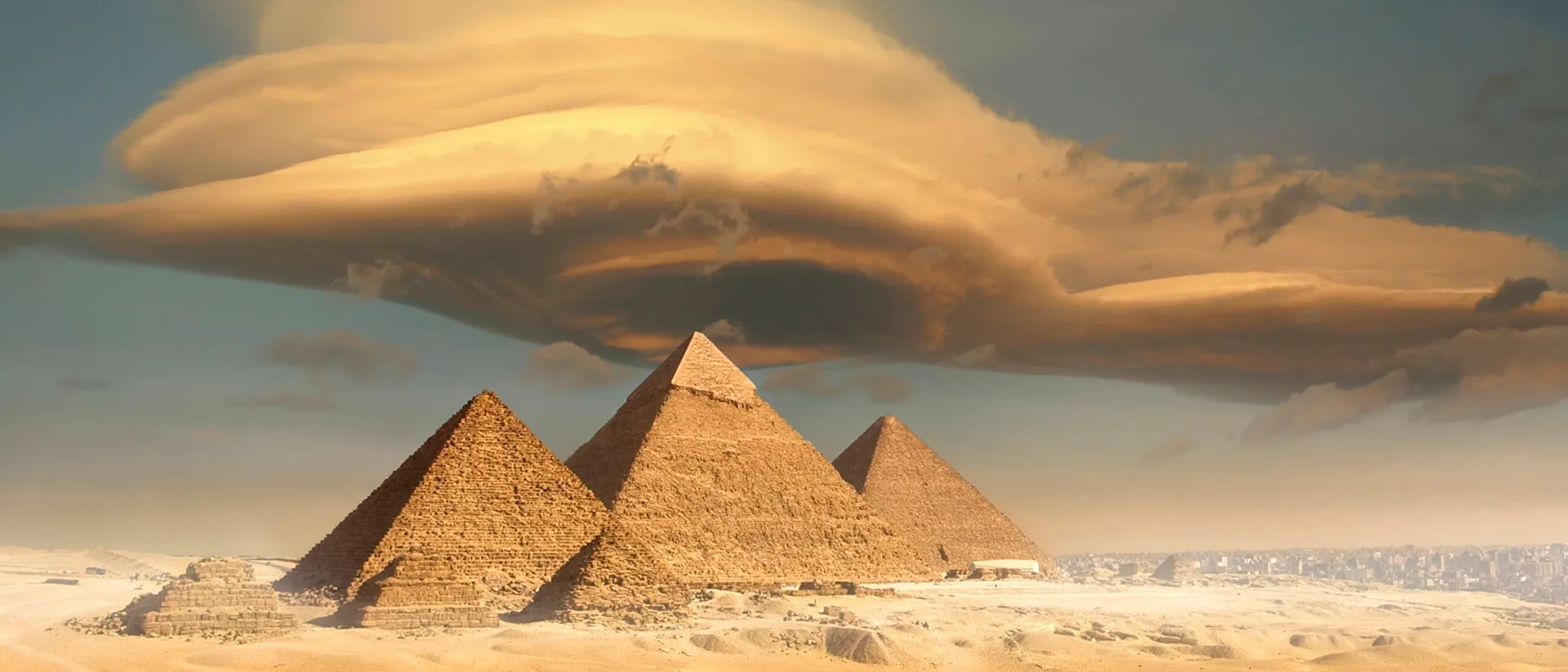 Dramatic storm cloud above pyramids in Giza, Egypt