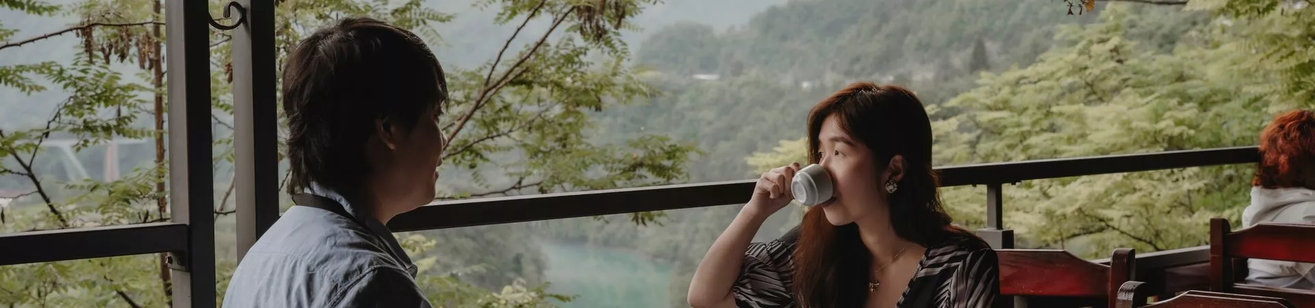 Guests drinking in front of picturesque backdrop in the Balkans