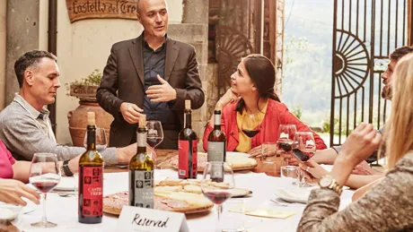 Wine tasting by the table in Castello Del Trebbio, Italy