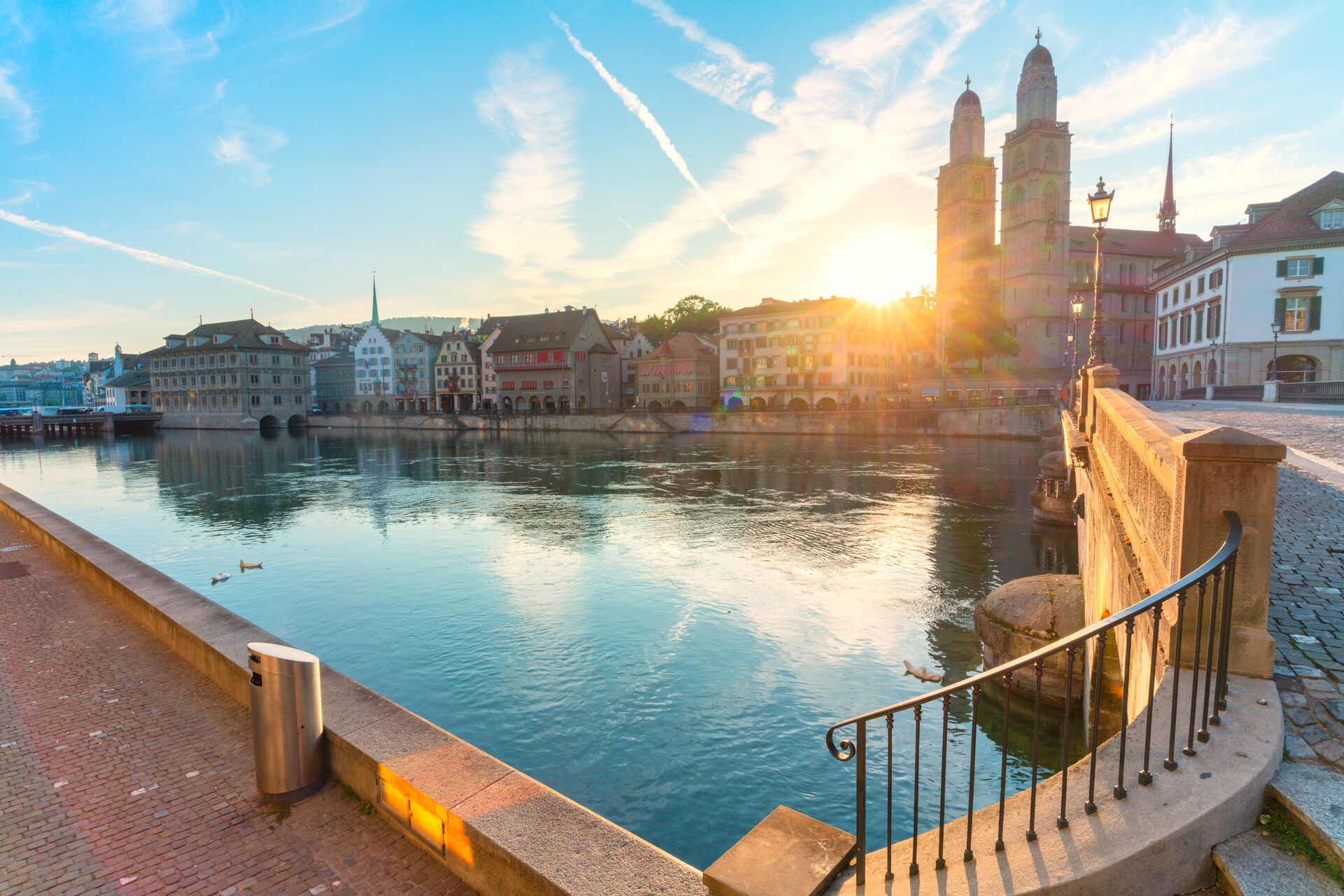 The sun shines through iconic landmarks in Zurich