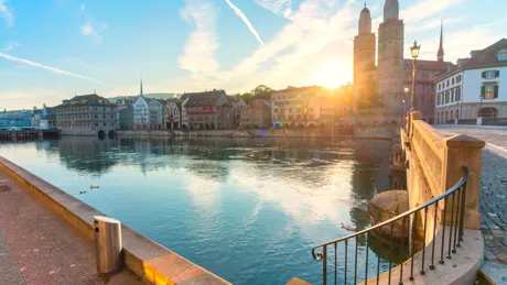 The sun shines through iconic landmarks in Zurich