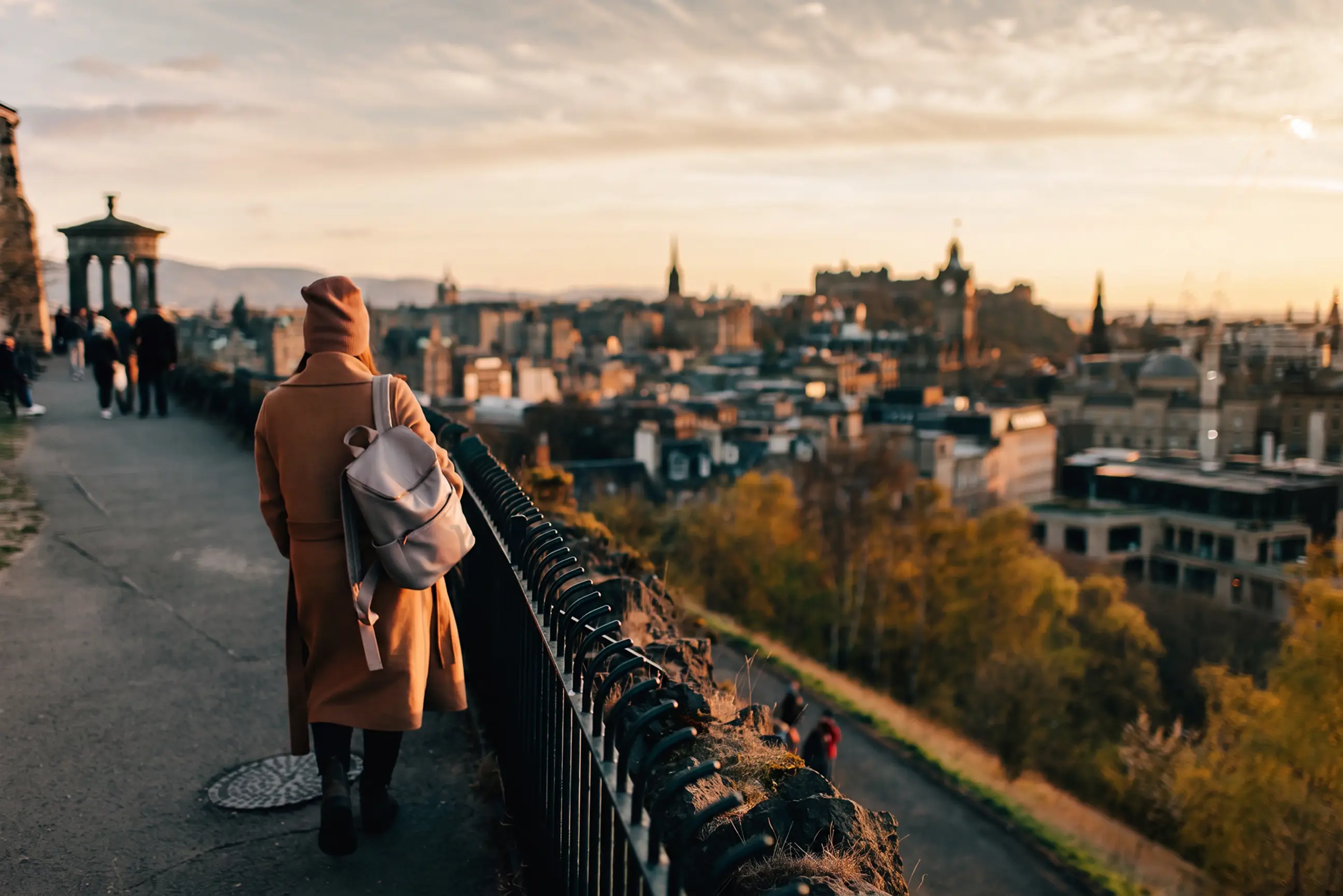 day-hero-woman-enjoying-view-edinburgh-scotland-1159612853.webp