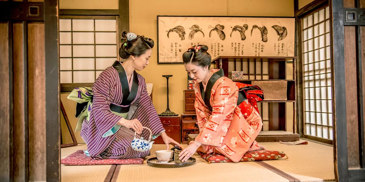 Women in Kimono drinking matcha tea during a traditional Tea Ceremony in Kyoto, Japan