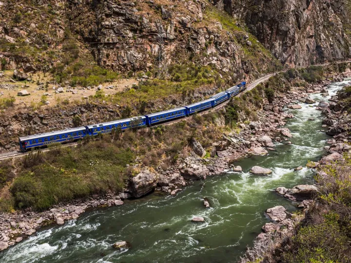 Train to Machu Picchu moving near the river