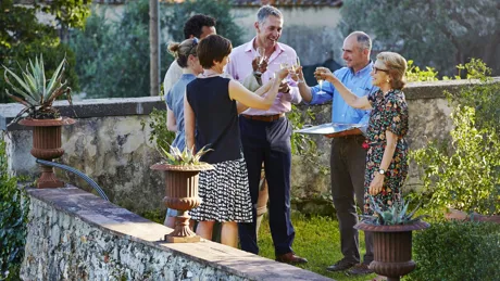 Group of people making a toast on Italian terrace in Florence