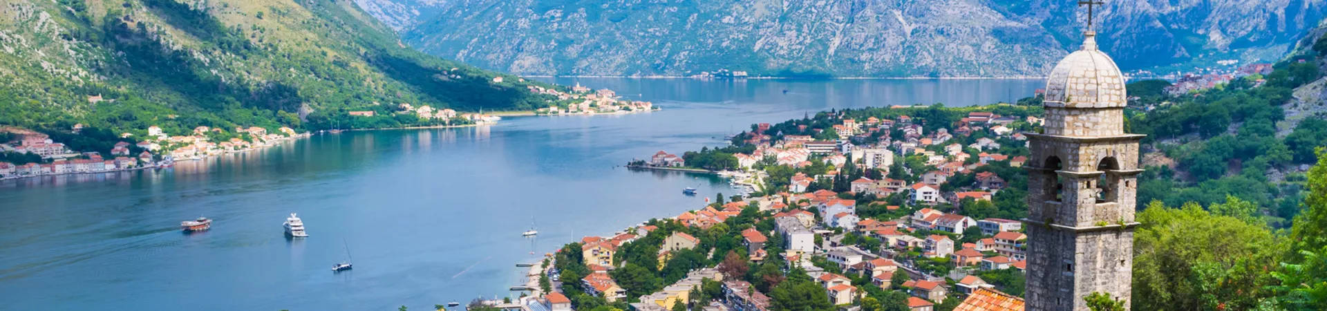 View of the city located by the lake and surrounded by mountains