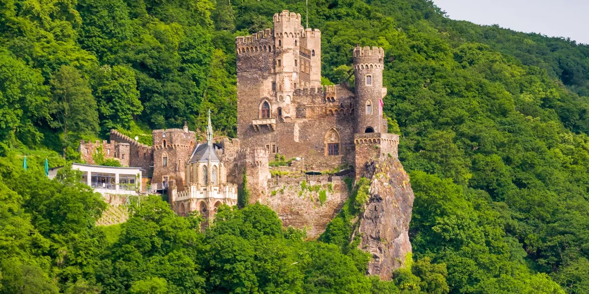 Rheinstein Castle in Germany amongst the hills and trees