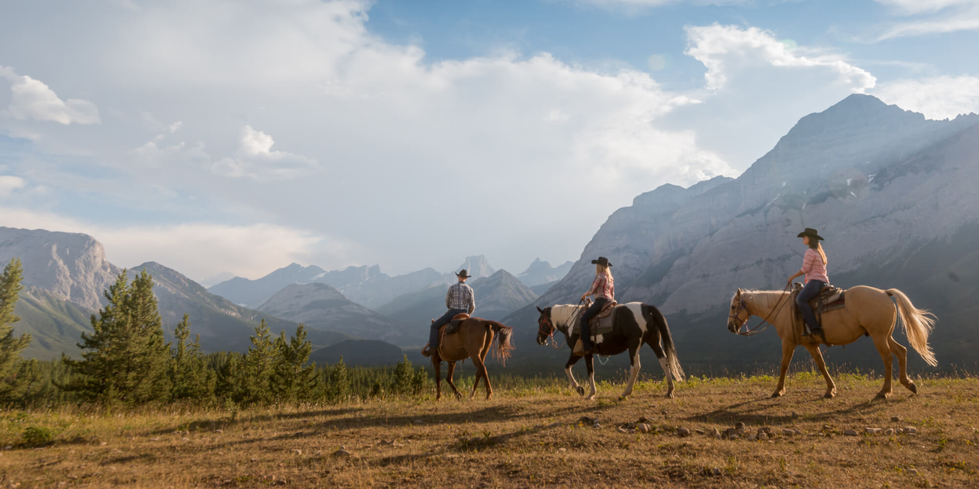 Horseback riding in Alberta mountains, Canada