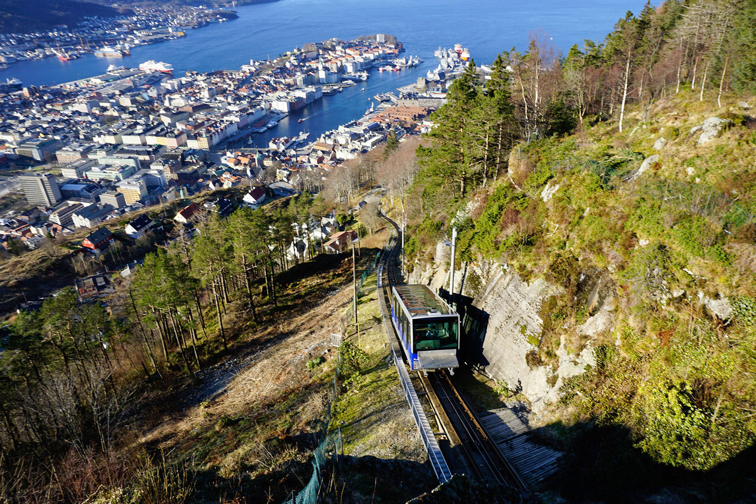 Fløibanen funicular climbing mountain with panoramic view of Bergen harbour and city