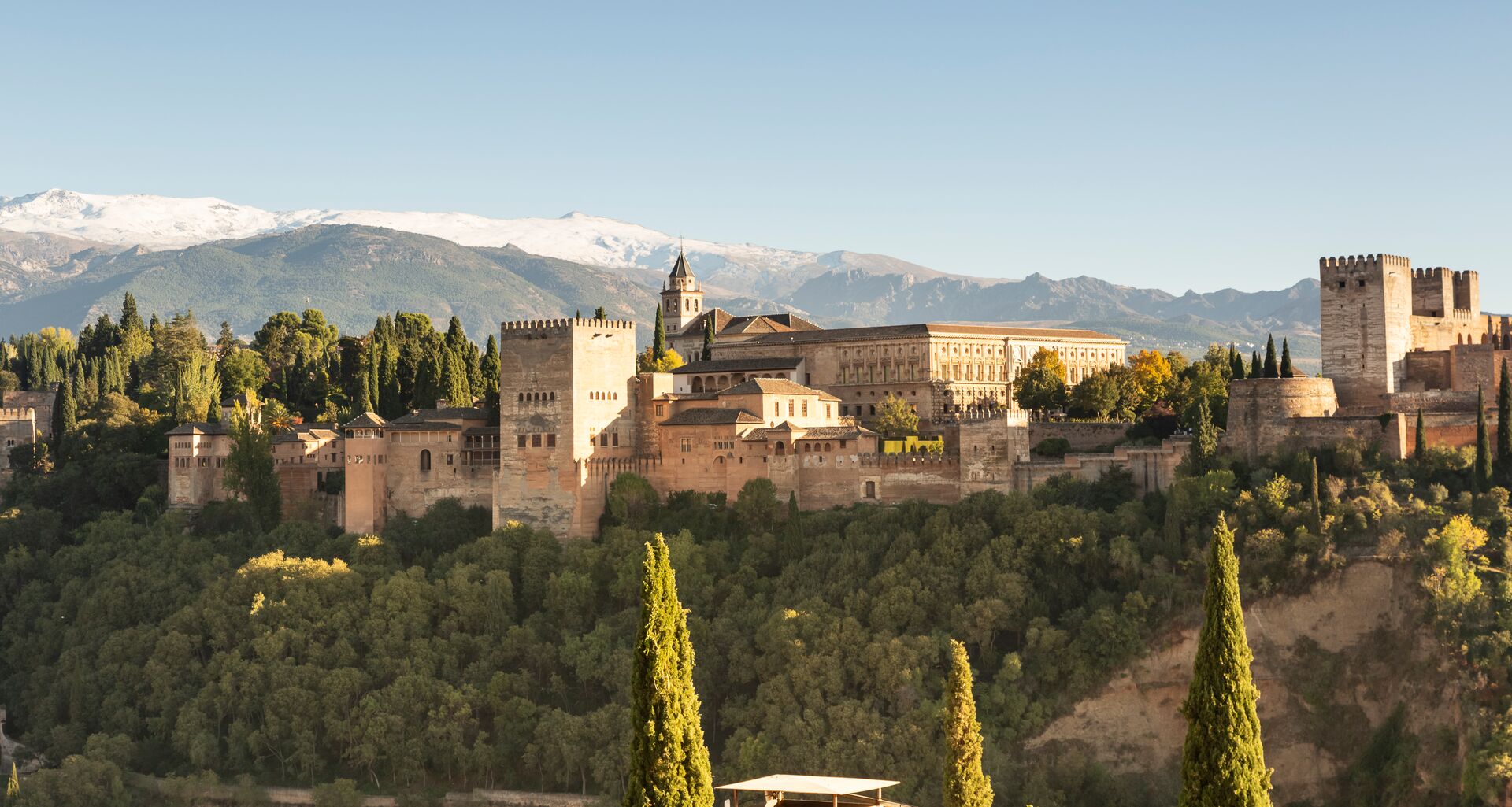 Panorama of the Alhambra in Grenada, Andalusia, Spain with the mountains behind it